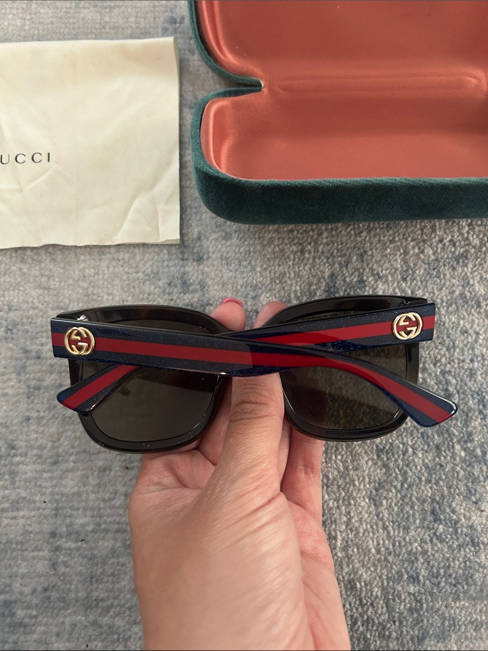Gucci Black Frame Sunglasses with Dark Lenses